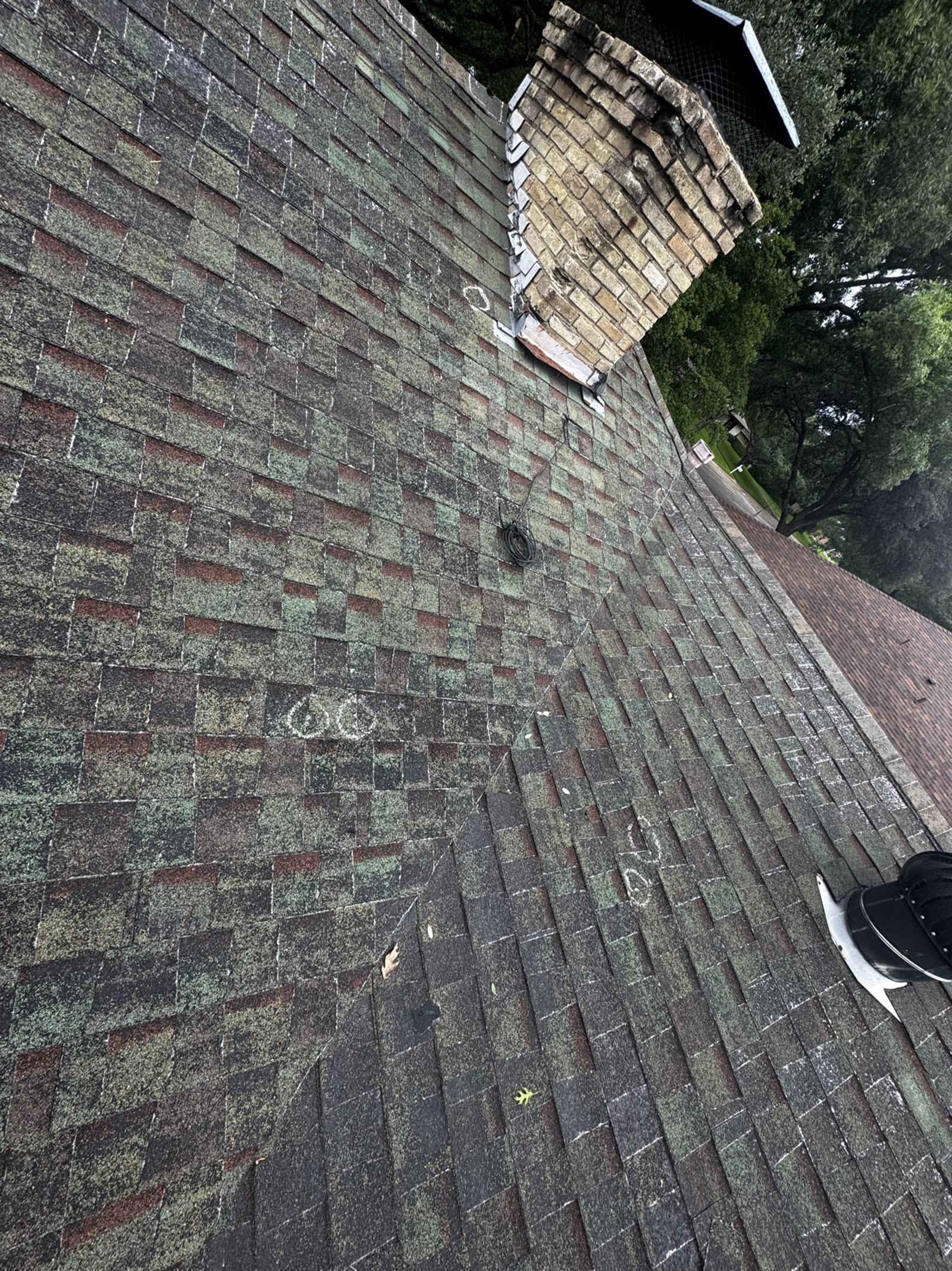 Before: Before and after: hail-damaged shingles with chalk markings beside the finished replacement roof in Dallas