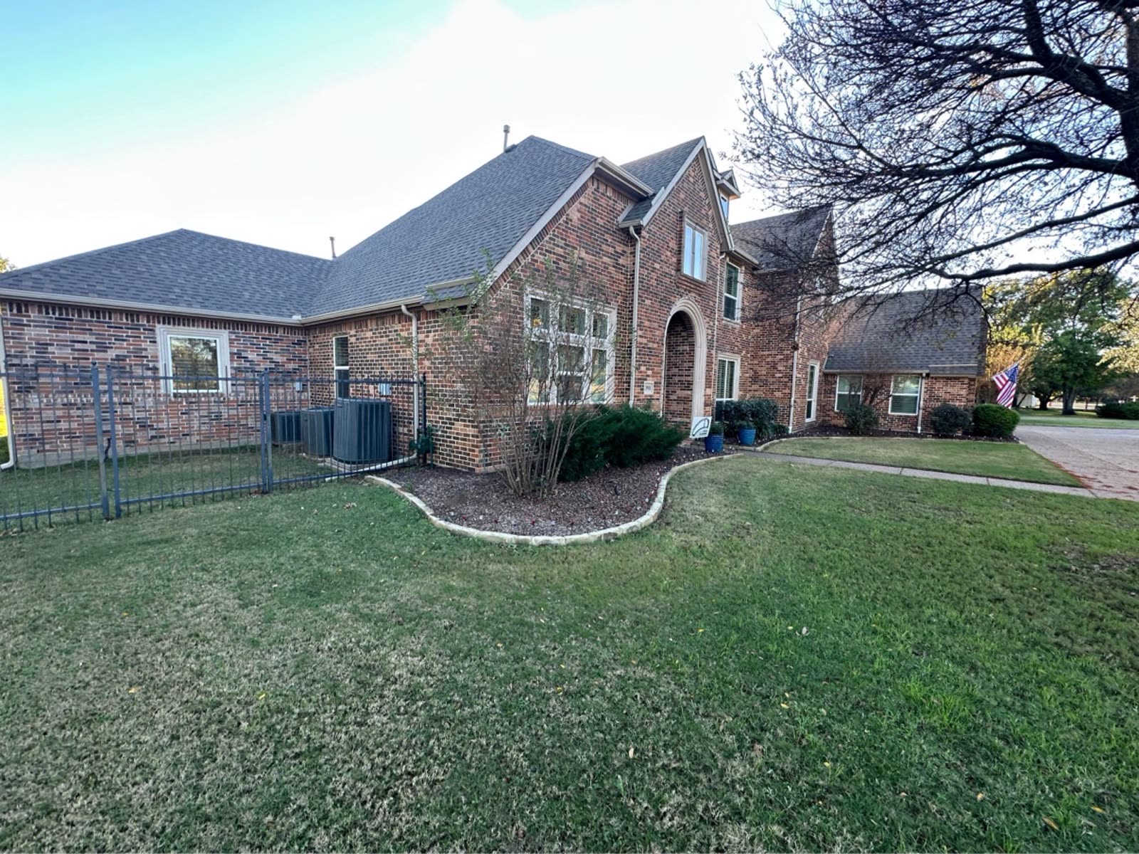 Before: Before and after: Flower Mound home with hail-damaged roof beside the finished replacement